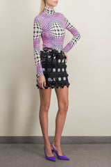 Sparkle mini skirt with circular mirror-effect discs