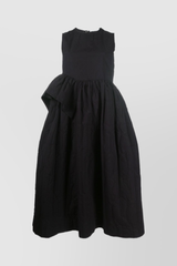 Sleeveless dress with ruffled detail on the side