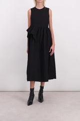 Sleeveless dress with ruffled detail on the side