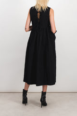 Sleeveless dress with ruffled detail on the side