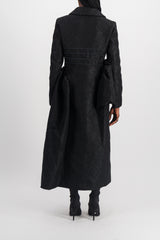 Fitted black coat with asymmetric side panels